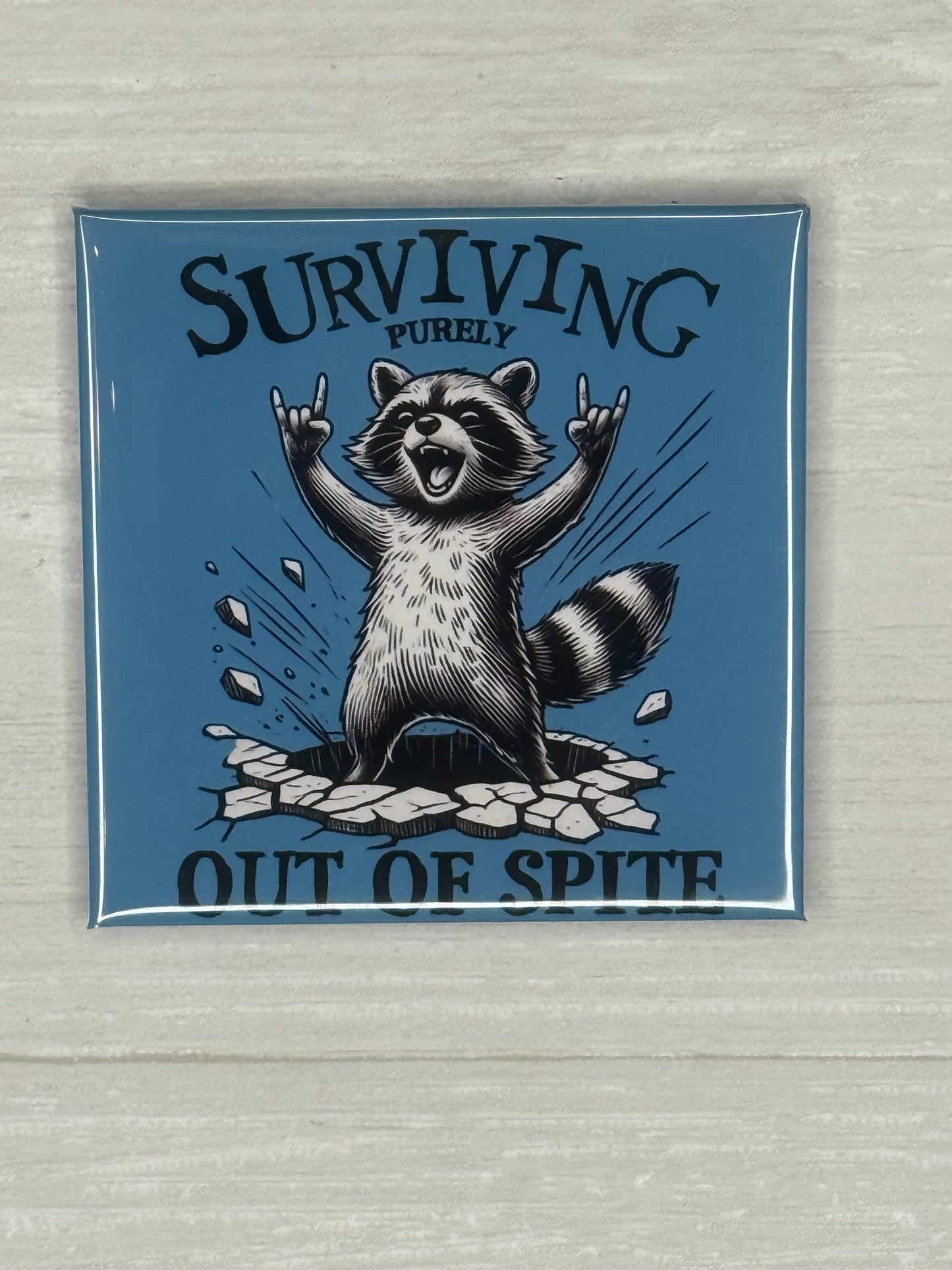 Surviving purely out of Spite Racoon Magnet
